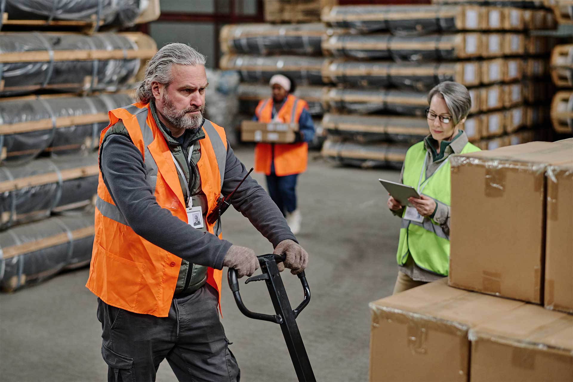 old man working in logistics warehouse