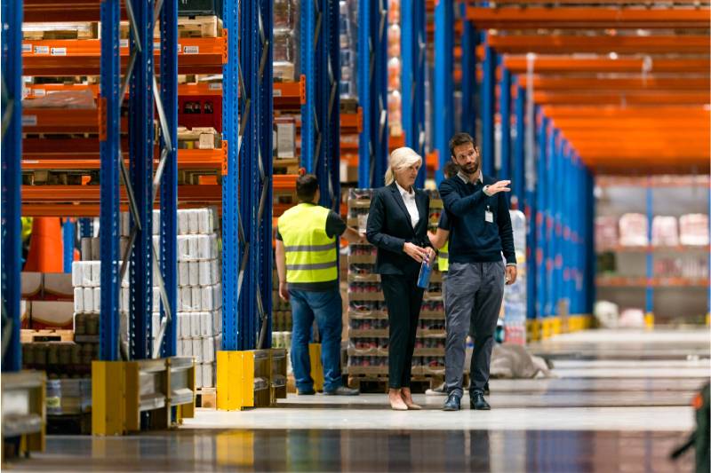 warehouse staff talking to each other